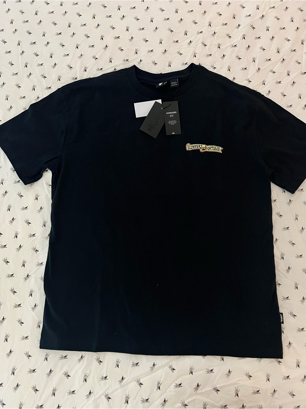 Quiksilver Black Short-Sleeve Graphic Tee with surfers of fortune.